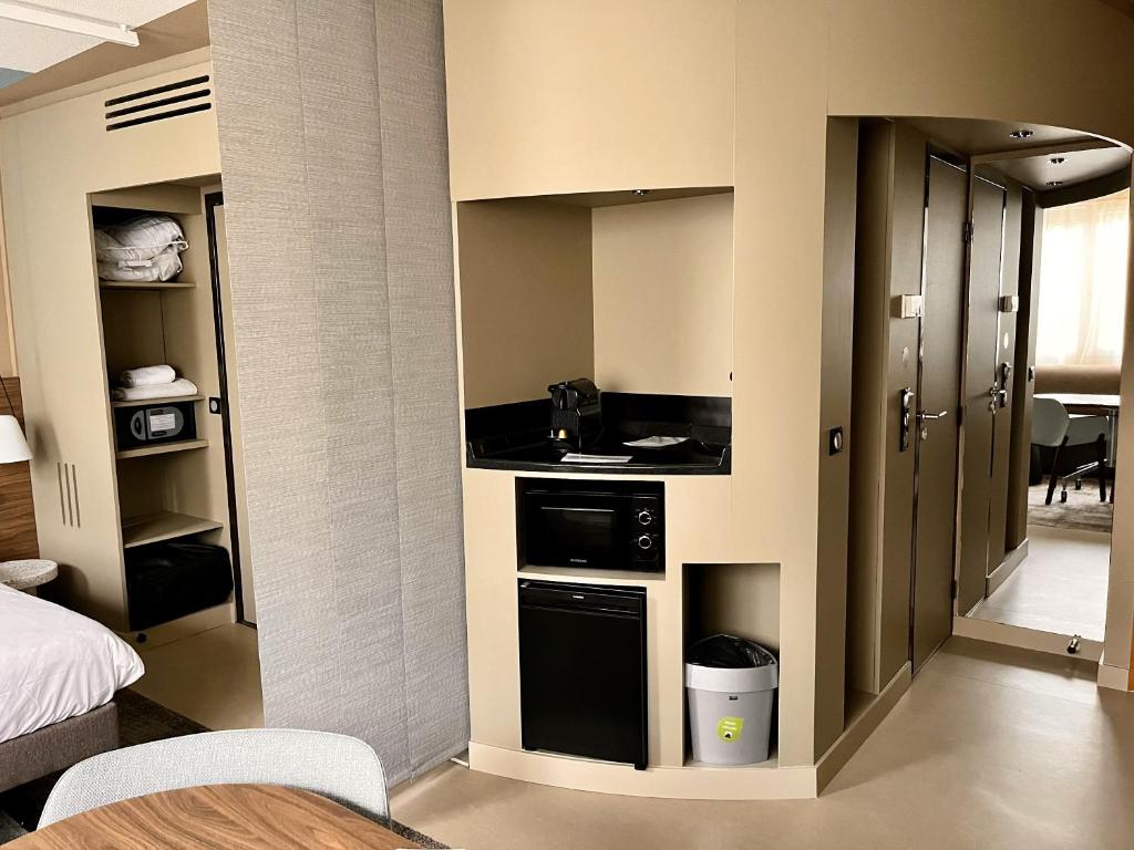 Kuchyň nebo kuchyňský kout v ubytování Novotel Suites Clermont Ferrand Polydome