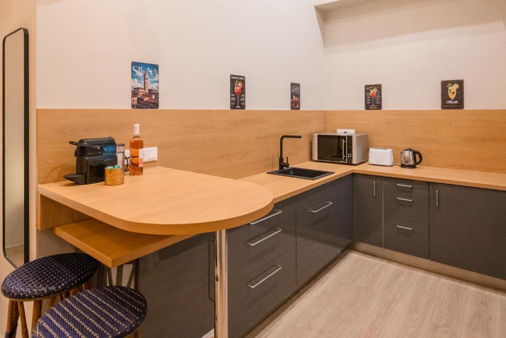 Kuchyňa alebo kuchynka v ubytovaní Siena Haven - Urban Suite