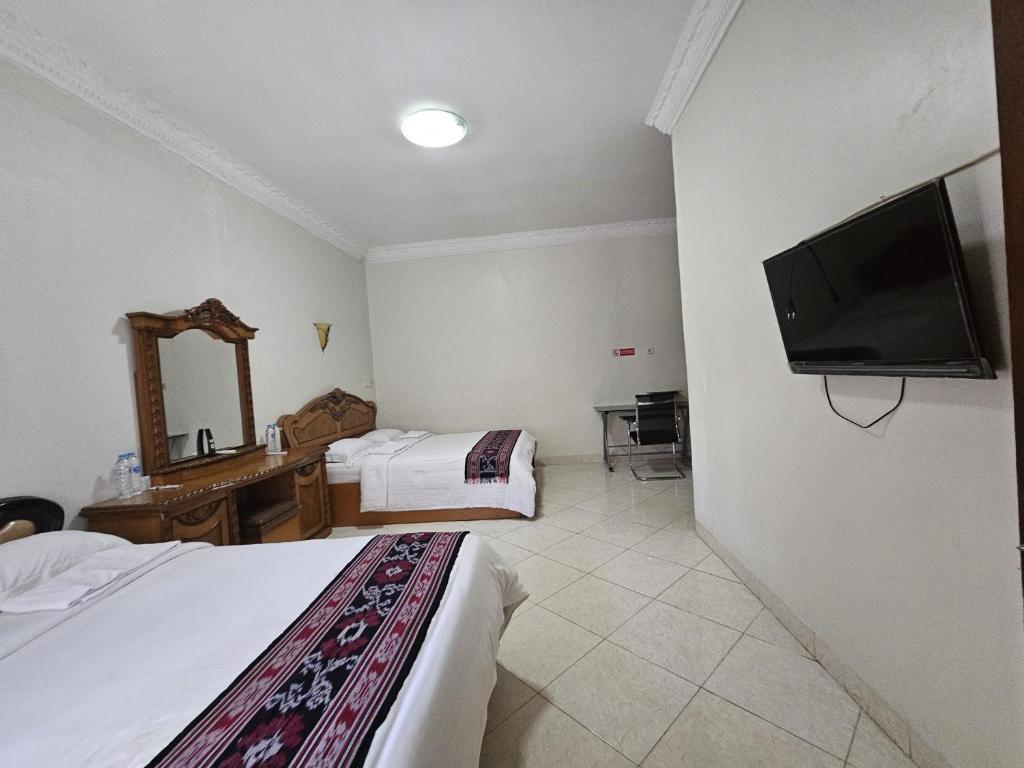 TV a/nebo společenská místnost v ubytování Flamboyan House
