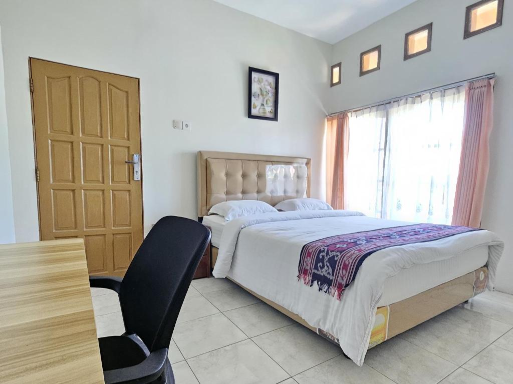 Postel nebo postele na pokoji v ubytování Flamboyan House