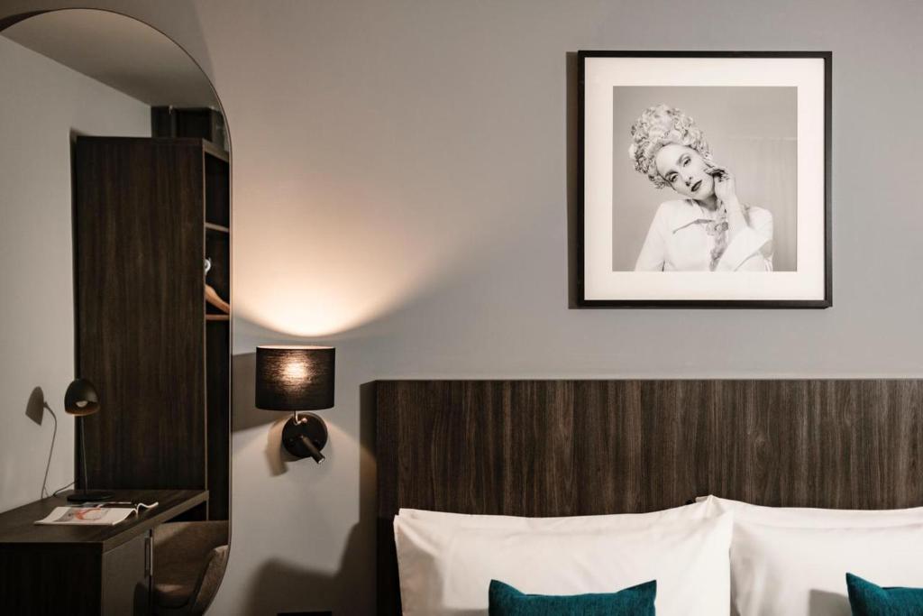 Postel nebo postele na pokoji v ubytování Spinola Hotel