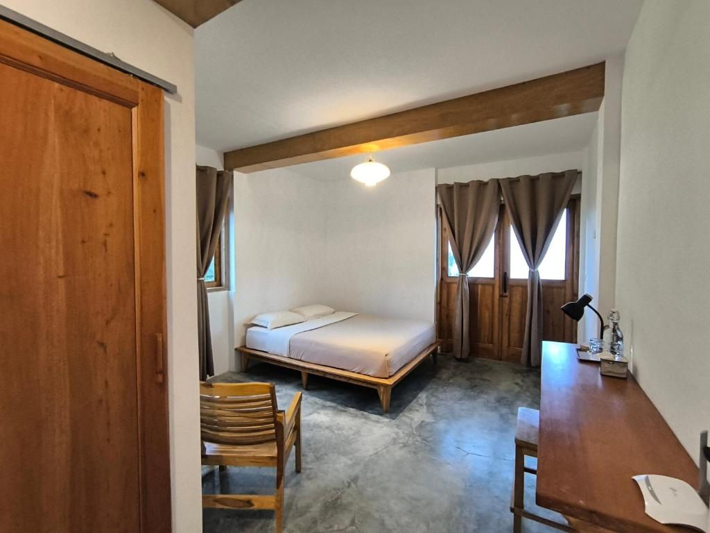 Postel nebo postele na pokoji v ubytování Maison Manendra - Bromo