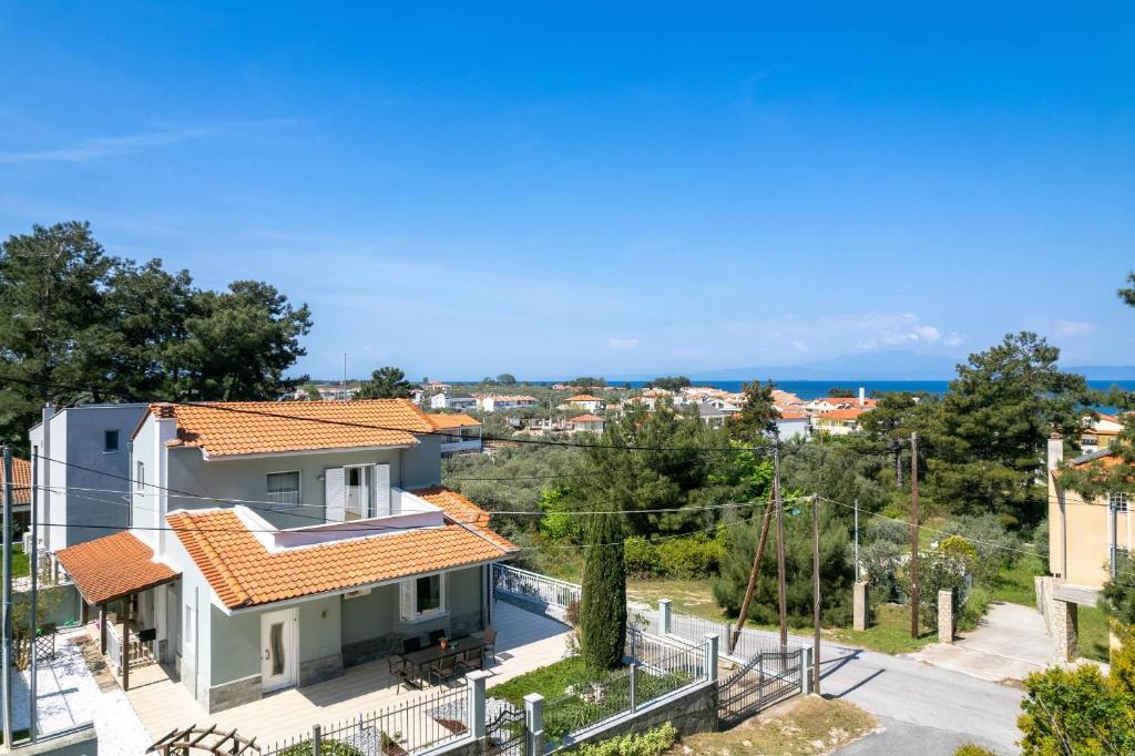 a villa with a view of the ocean at Agapi Deluxe Villa in Skala Rachoniou