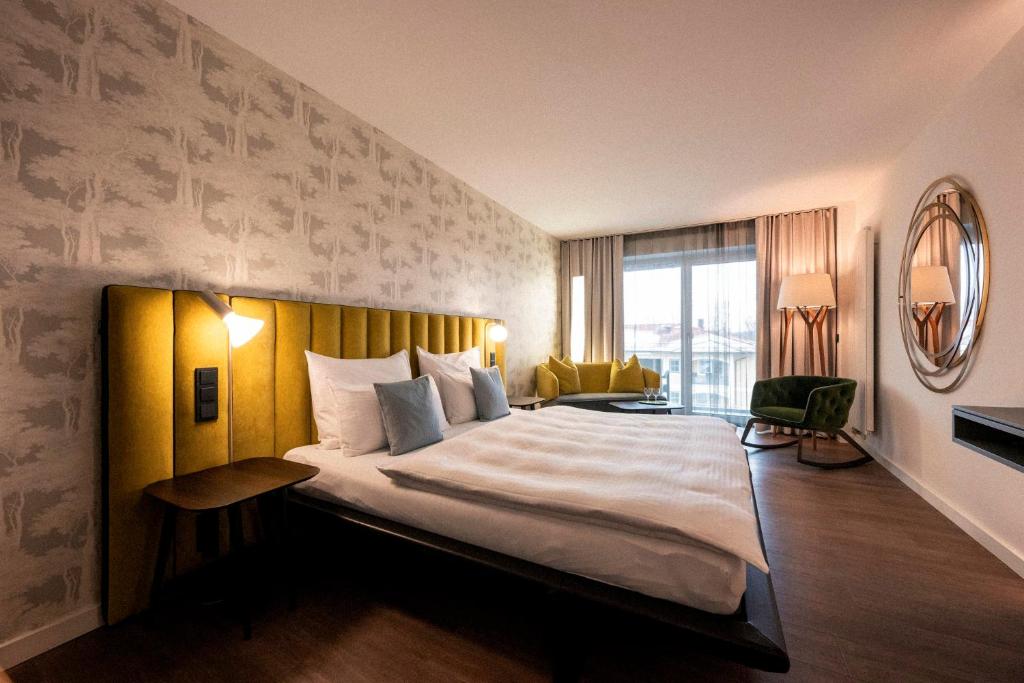 Postel nebo postele na pokoji v ubytování Wellnesshotel Wittelsbach