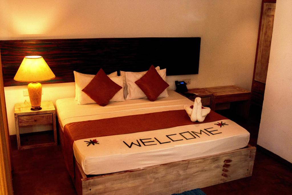 Postel nebo postele na pokoji v ubytování Pigeon Island Beach Resort and Spa
