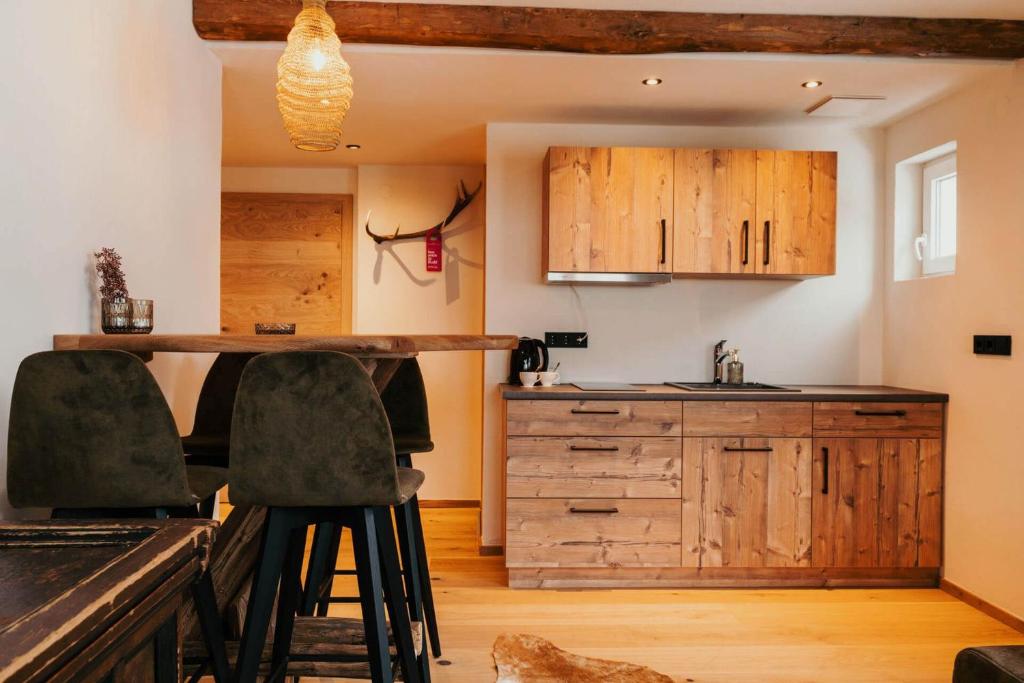 Kuchyň nebo kuchyňský kout v ubytování Hotel Glücksschmiede - Hinterglemm