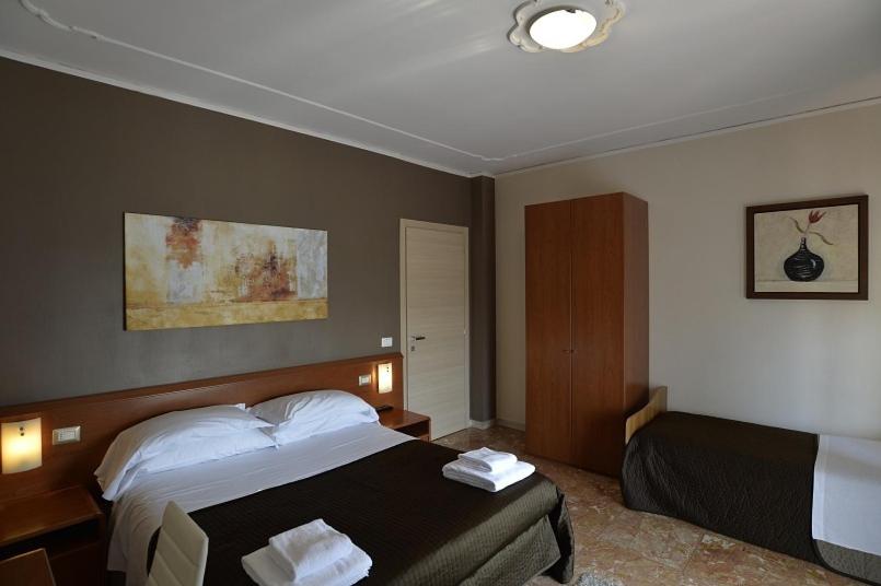 Postel nebo postele na pokoji v ubytování B&B Mariclà