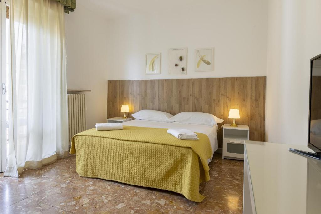 Postel nebo postele na pokoji v ubytování B&B Mariclà