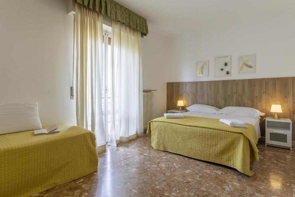 Postel nebo postele na pokoji v ubytování B&B Mariclà