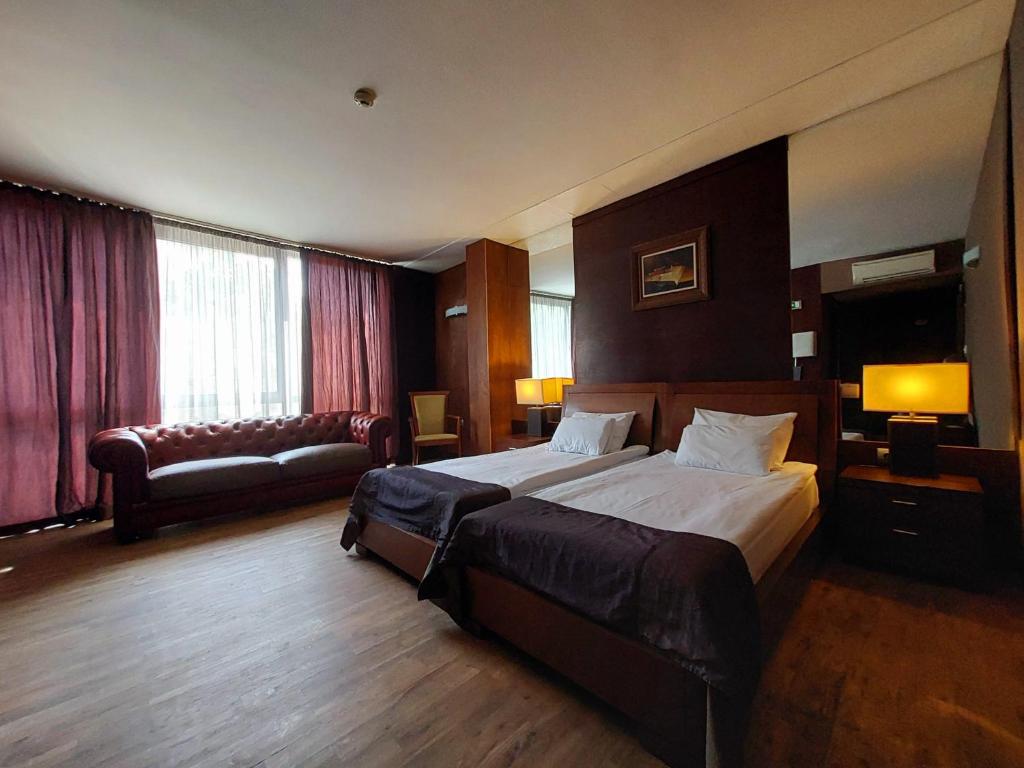 Postel nebo postele na pokoji v ubytování Hotel City Pleven