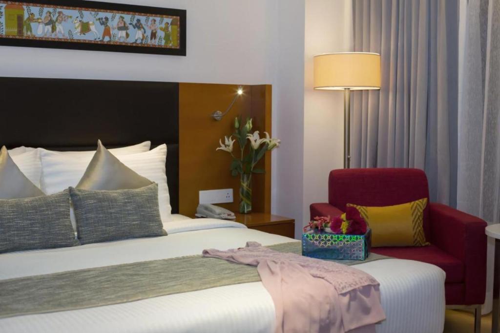 Postel nebo postele na pokoji v ubytování Hotel D Tark Plaza