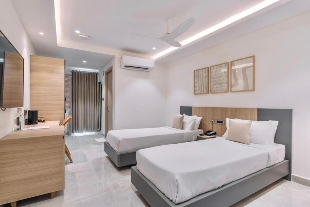 Postel nebo postele na pokoji v ubytování Hotel D Tark Plaza