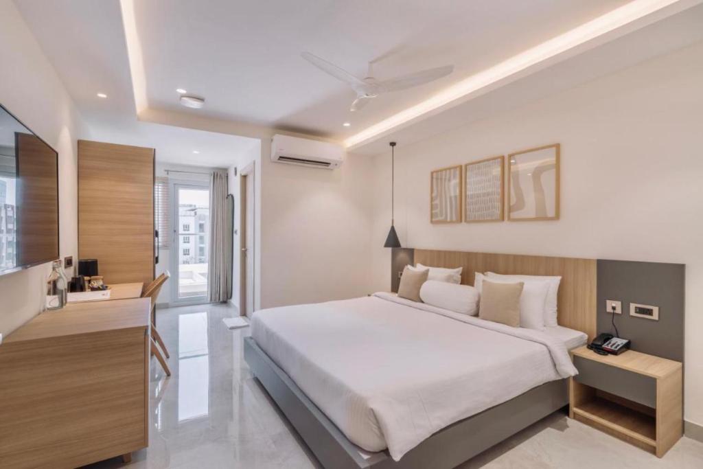 Postel nebo postele na pokoji v ubytování Hotel D Tark Plaza