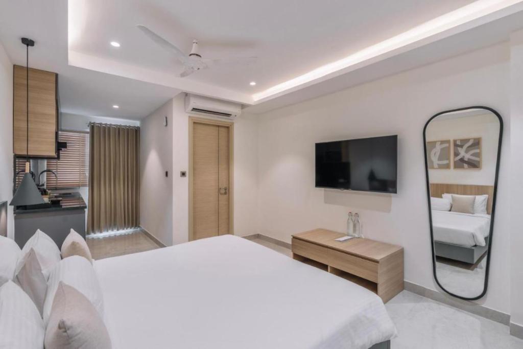 Postel nebo postele na pokoji v ubytování Hotel D Tark Plaza