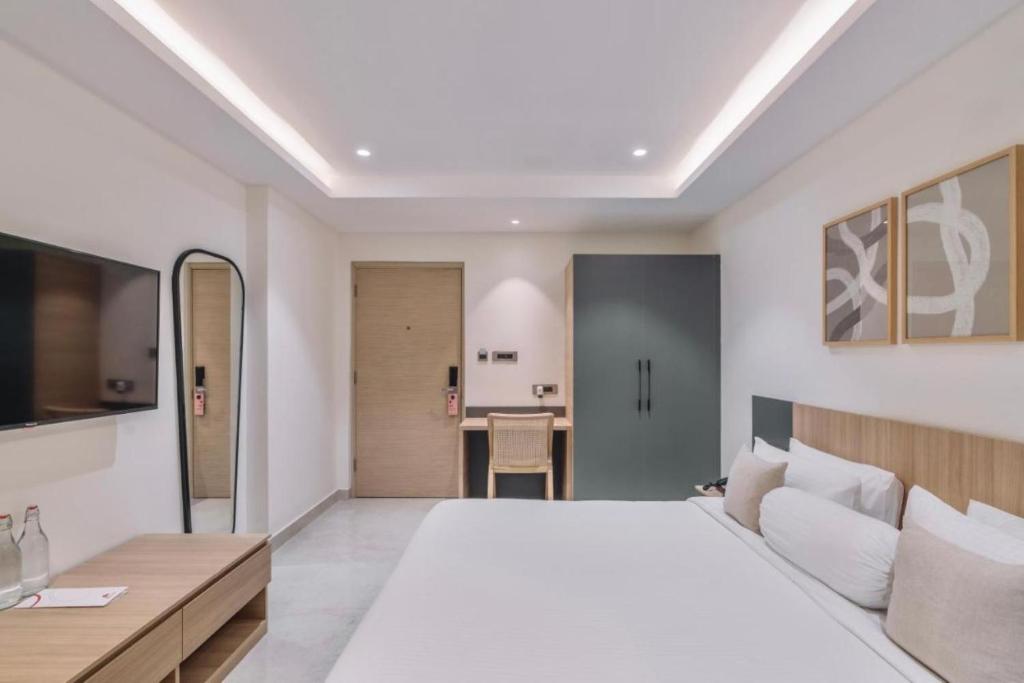 Postel nebo postele na pokoji v ubytování Hotel D Tark Plaza