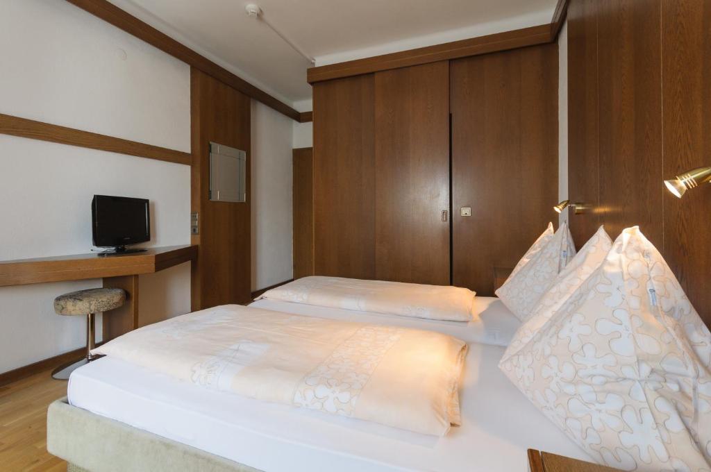 Postel nebo postele na pokoji v ubytování Hotel Tautermann