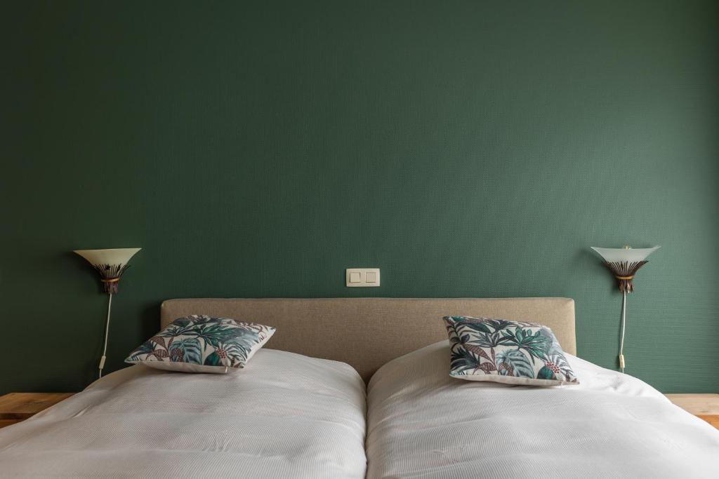 Postel nebo postele na pokoji v ubytování B&B De Floreffe