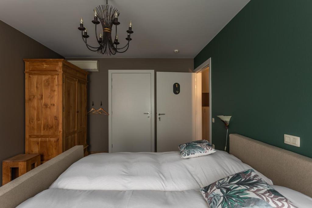Postel nebo postele na pokoji v ubytování B&B De Floreffe