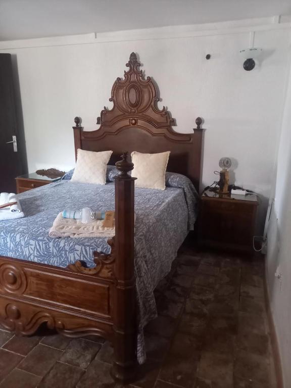 A bed or beds in a room at Hostal Rural Mas Blanc