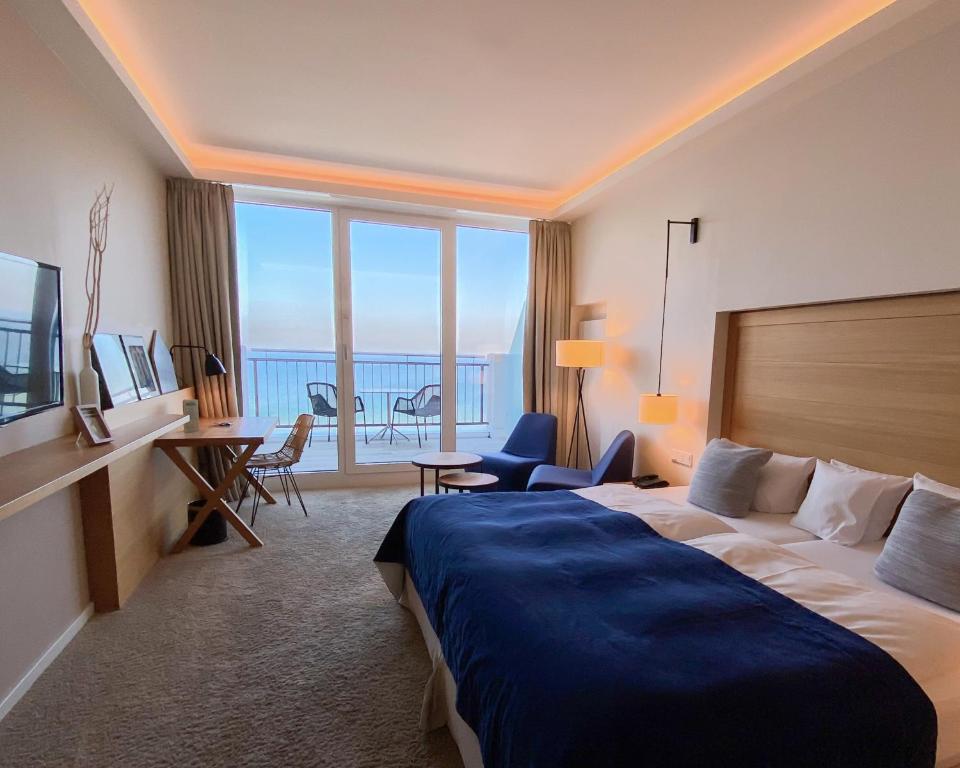 Postel nebo postele na pokoji v ubytování SeeHuus Lifestyle Hotel