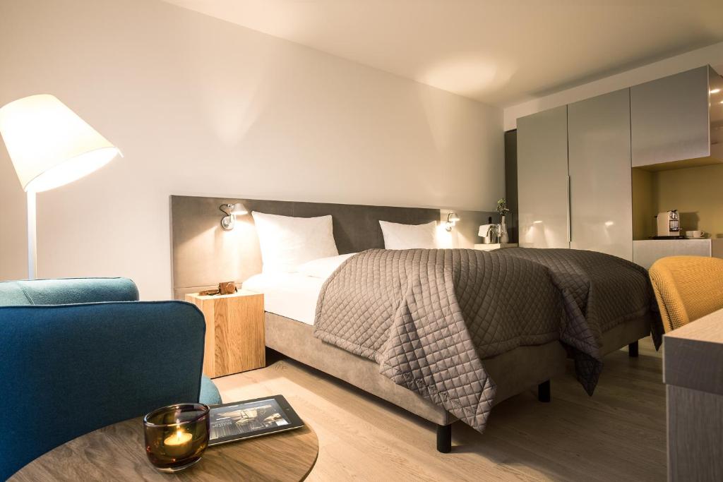 Ein Bett oder Betten in einem Zimmer der Unterkunft Maximilians Boutique-Hotel Landau