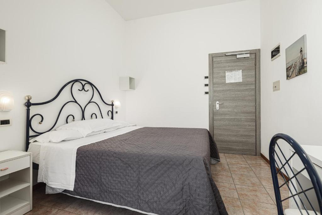 Postel nebo postele na pokoji v ubytování BI Hotel
