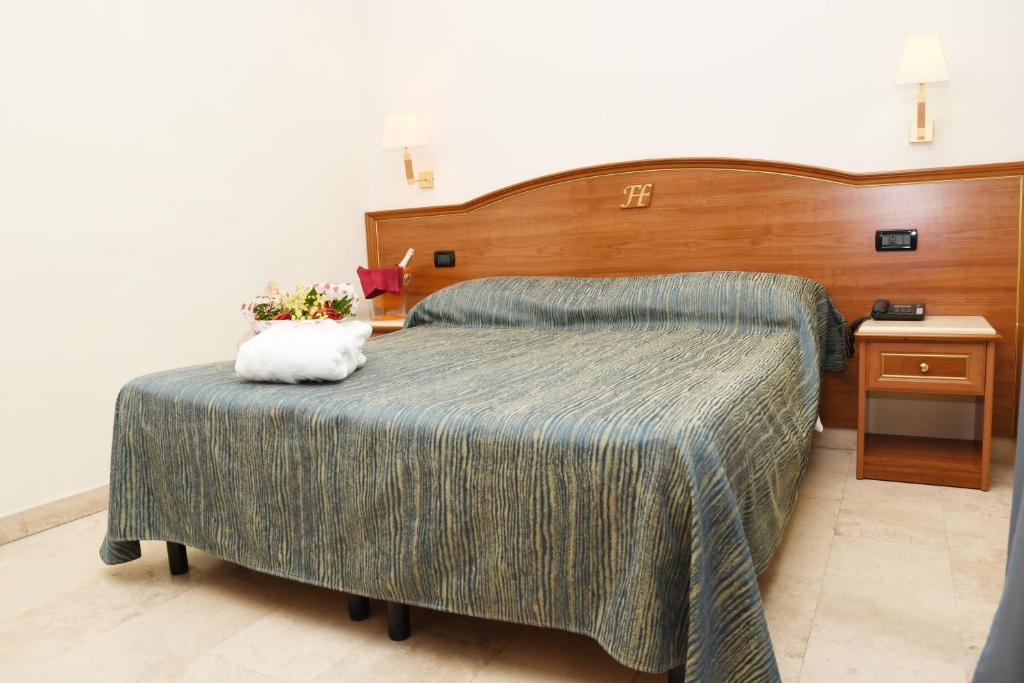 Postel nebo postele na pokoji v ubytování Fashion Hotel