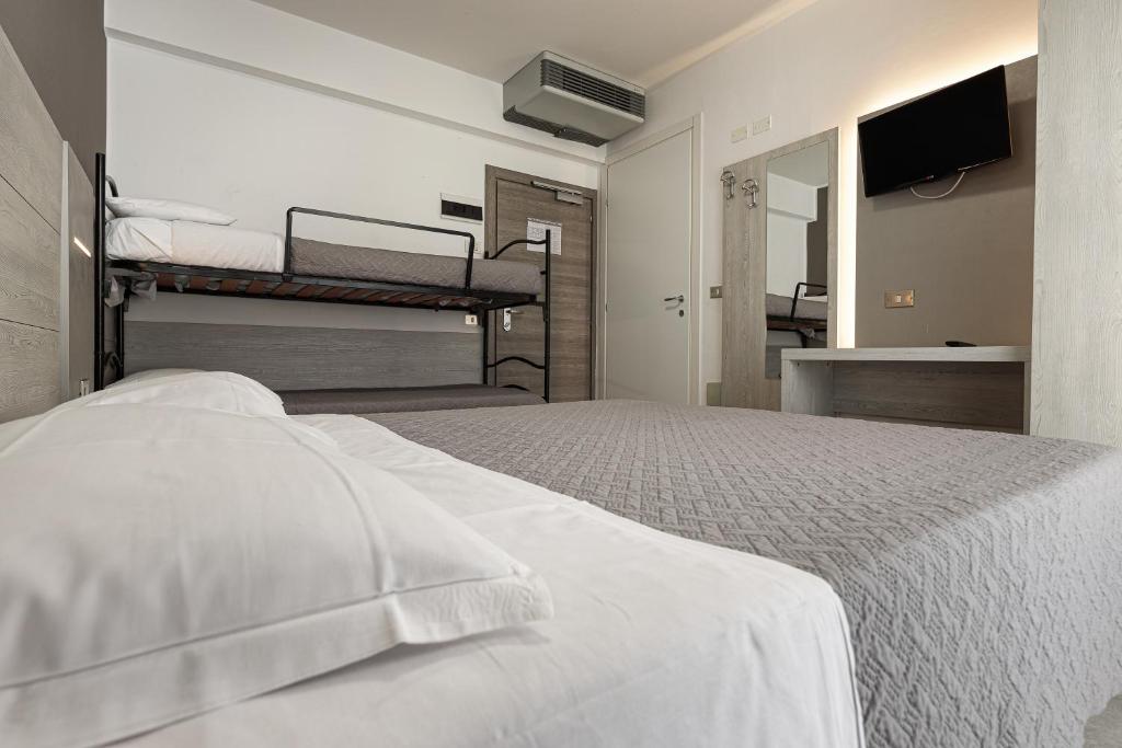 Postel nebo postele na pokoji v ubytování BI Hotel