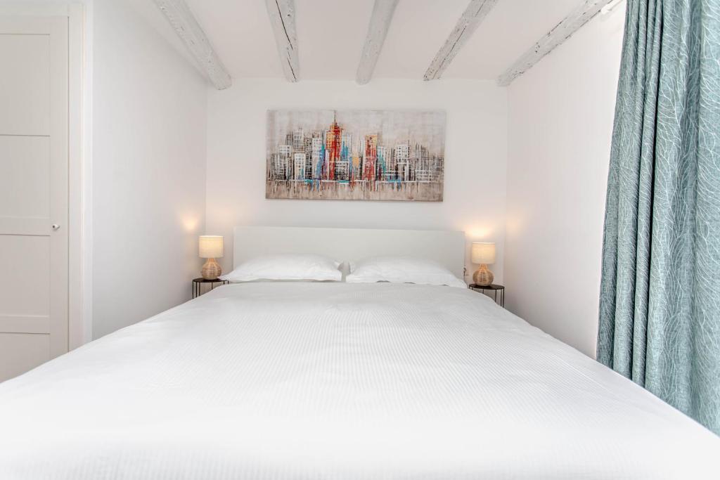Posteľ alebo postele v izbe v ubytovaní Apartman Dioniz