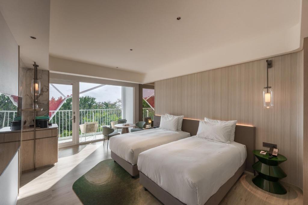 Postel nebo postele na pokoji v ubytování Hotel dua Kenting