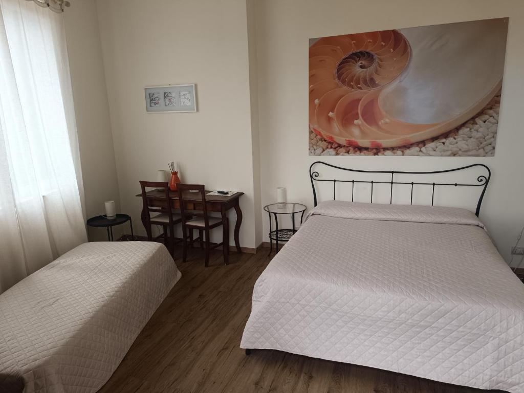 Postel nebo postele na pokoji v ubytování B&B Stella Marina