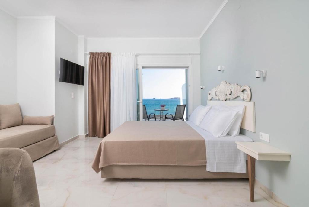 Postel nebo postele na pokoji v ubytování EluDes Seaside Suites