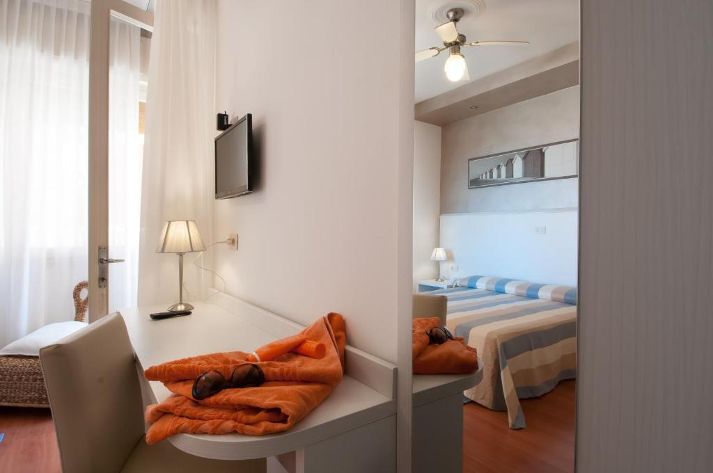 Postel nebo postele na pokoji v ubytování Hotel Telenia
