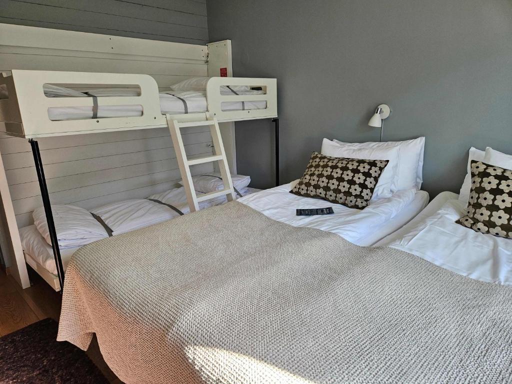 Postel nebo postele na pokoji v ubytování Hotell Lassalyckan