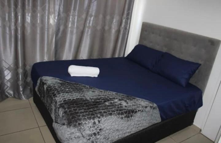 Postel nebo postele na pokoji v ubytování La Ndjolinoise