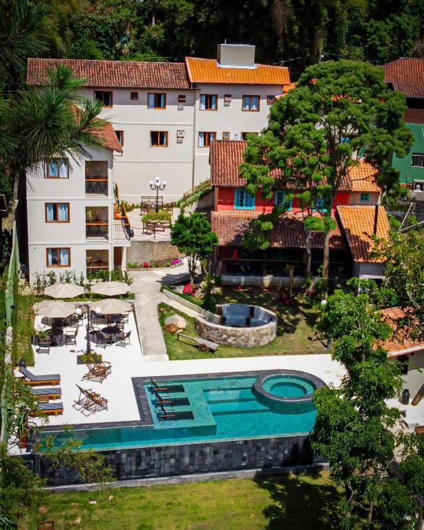 an aerial view of a hotel with a swimming pool at Pousada Villa Manso in Conceição da Ibitipoca