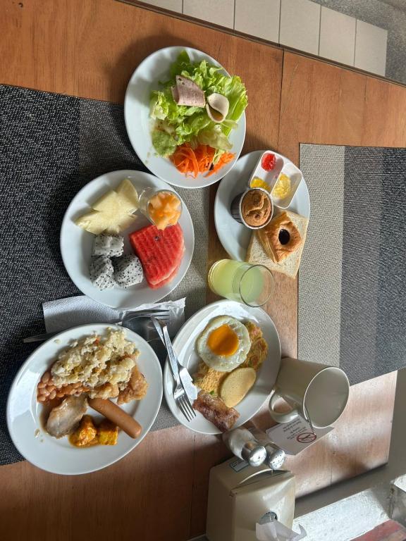 a group of plates of food on a table at Nirvana Rooms near Mall Road in Shimla