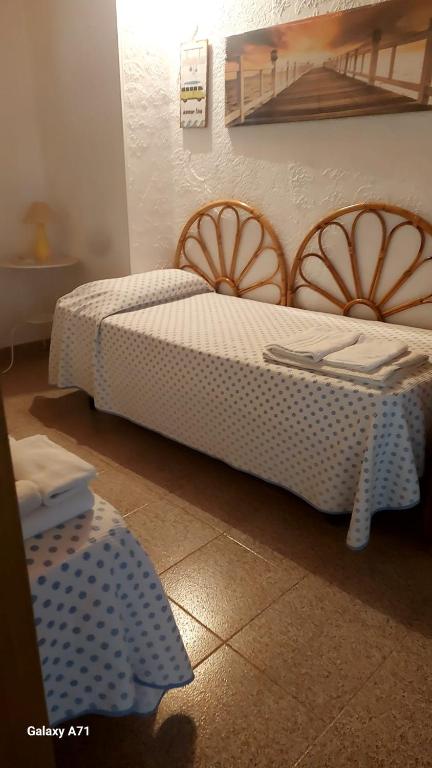 Postel nebo postele na pokoji v ubytování casa fronte mare puro relax
