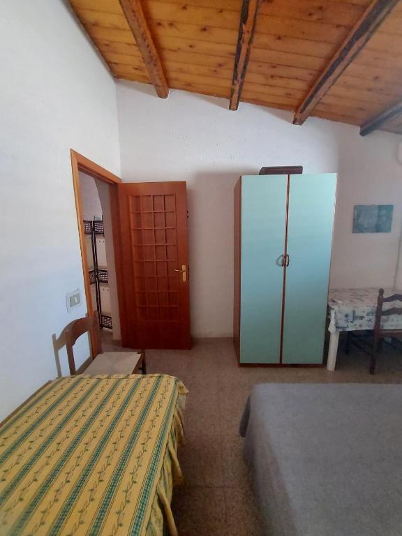 Postel nebo postele na pokoji v ubytování casa fronte mare puro relax