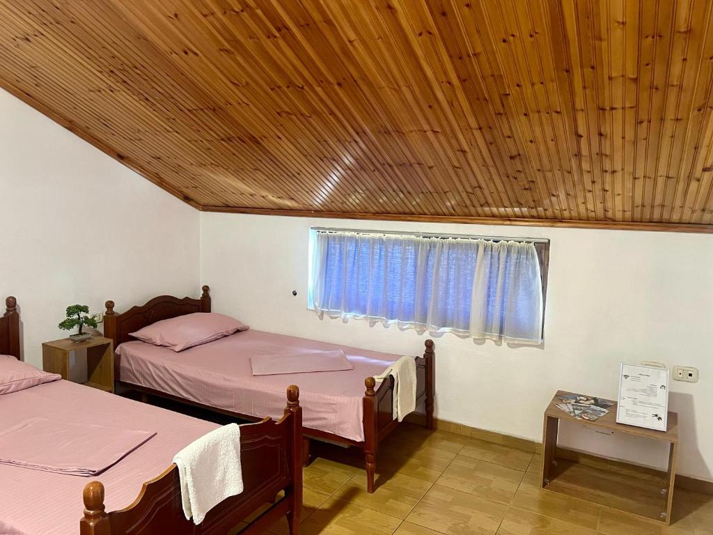 Postel nebo postele na pokoji v ubytování Happy Corner Guest House