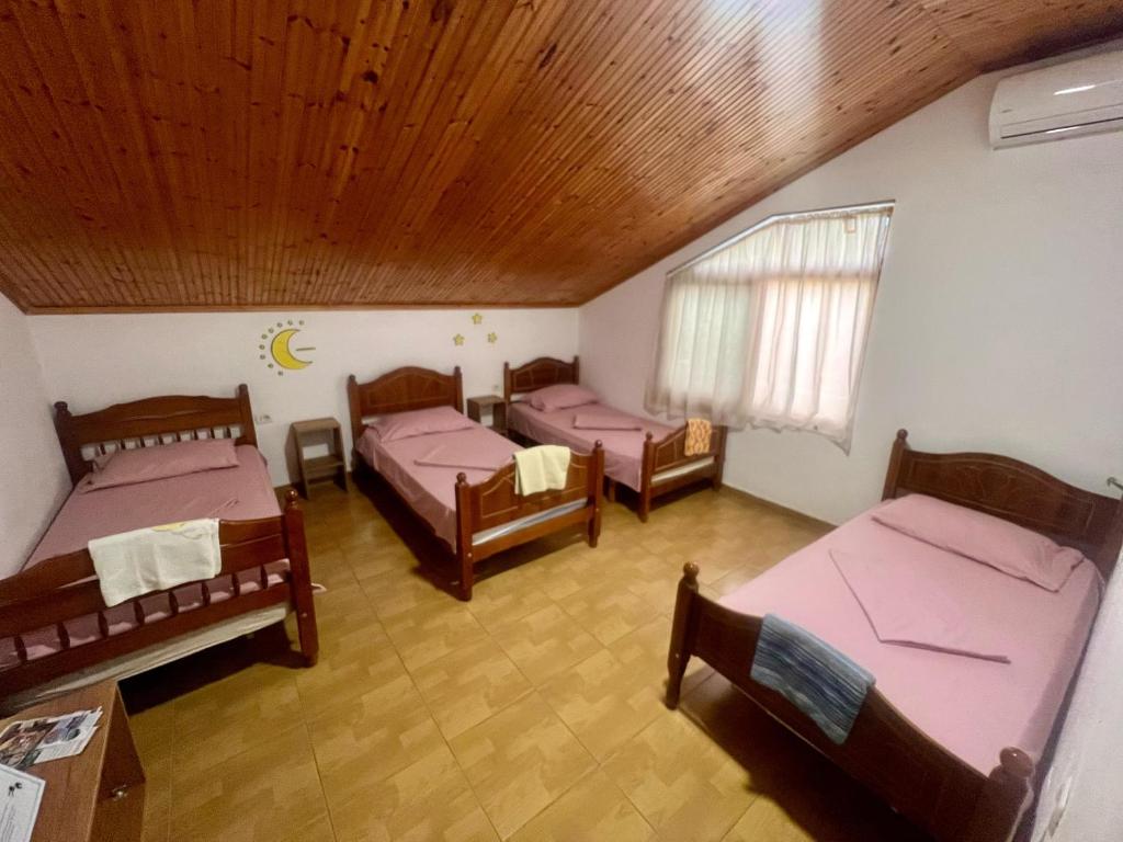 Postel nebo postele na pokoji v ubytování Happy Corner Guest House