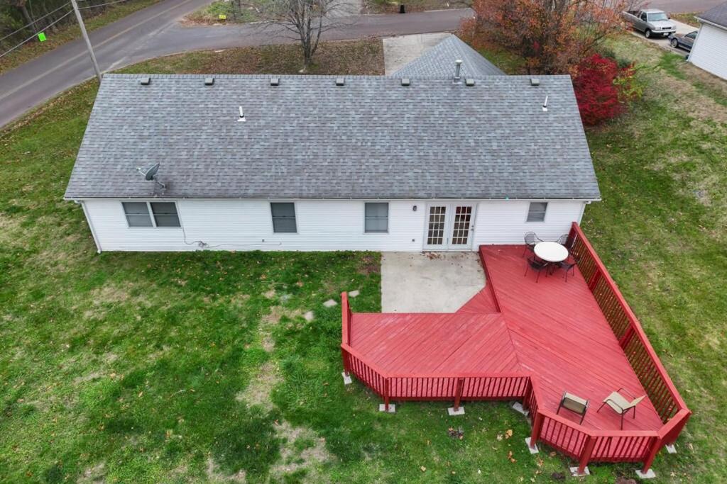 an aerial view of a house with a red roof at Cozy Retreat 3bdrm 2bath house with deck in Columbia