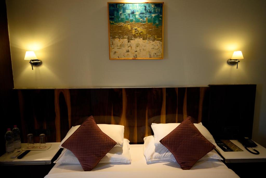 Postel nebo postele na pokoji v ubytování Hotel Holiday Resort