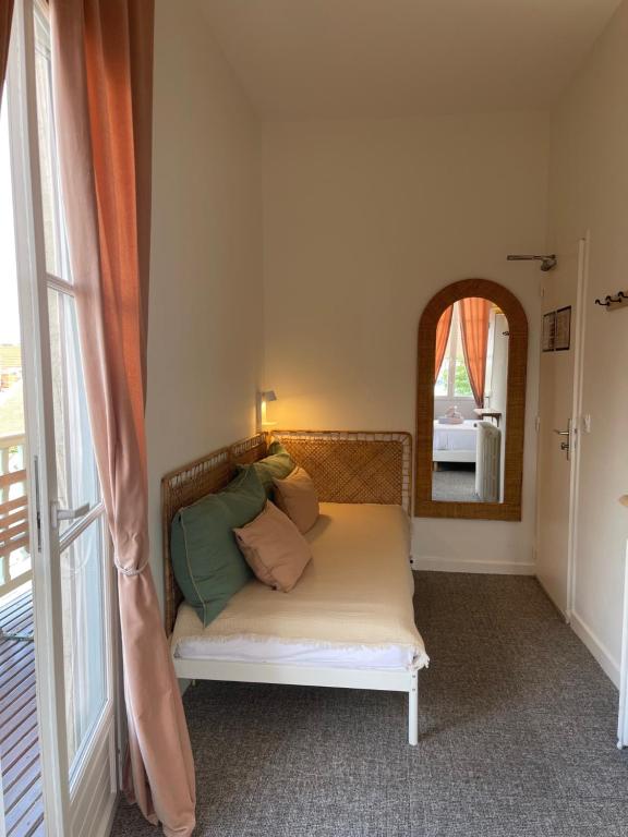 Postel nebo postele na pokoji v ubytování Hôtel Michelet Plage