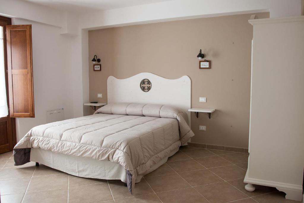 Postel nebo postele na pokoji v ubytování Il Vicoletto B&B