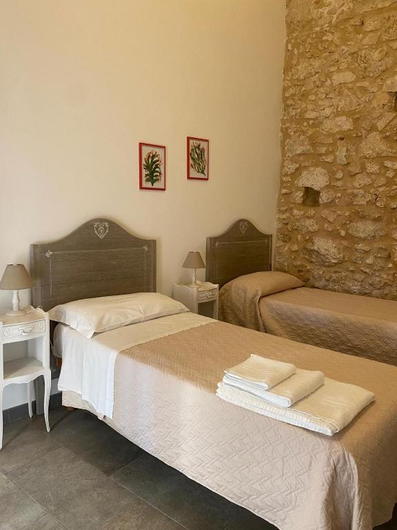 Postel nebo postele na pokoji v ubytování Corte Sicula