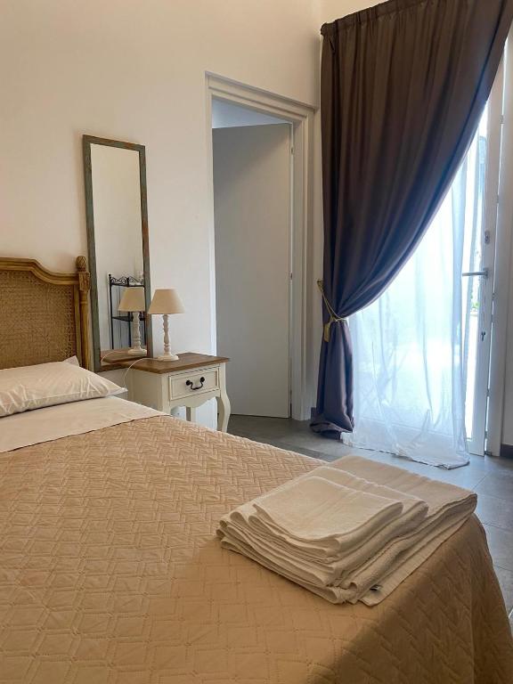Postel nebo postele na pokoji v ubytování Corte Sicula