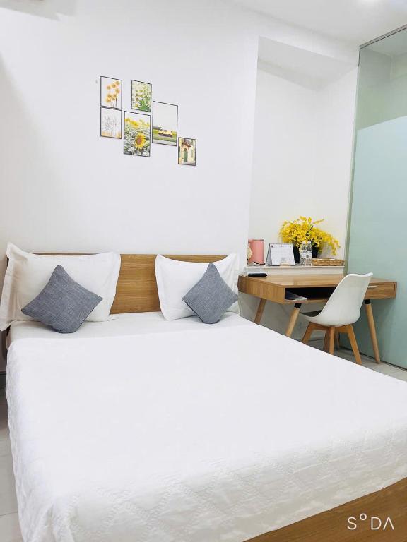 Postel nebo postele na pokoji v ubytování Hello SaiGon Homestay