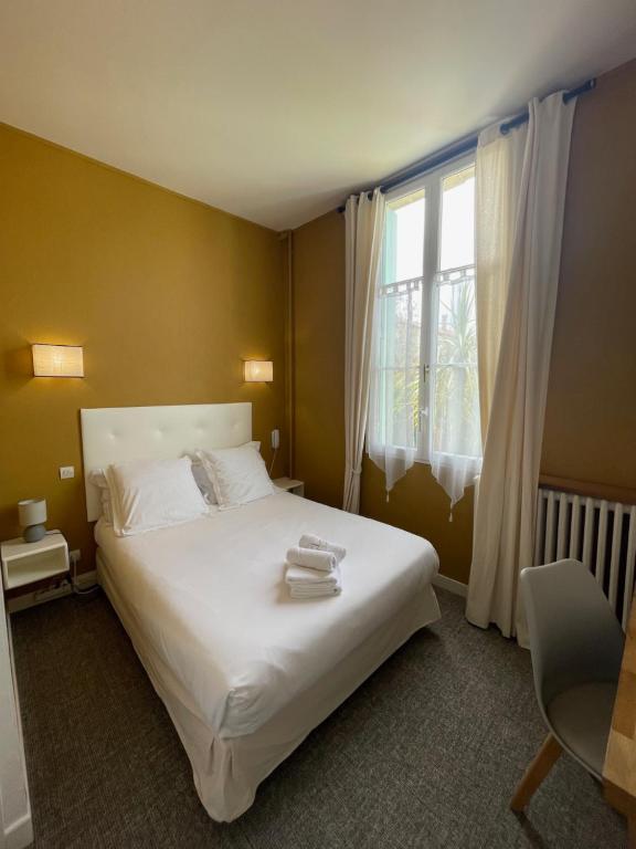 Postel nebo postele na pokoji v ubytování Hôtel Michelet Plage