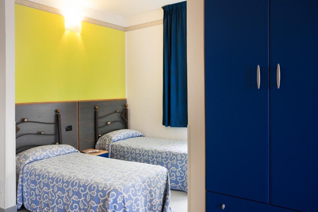 Postel nebo postele na pokoji v ubytování Hotel Côte D'Est
